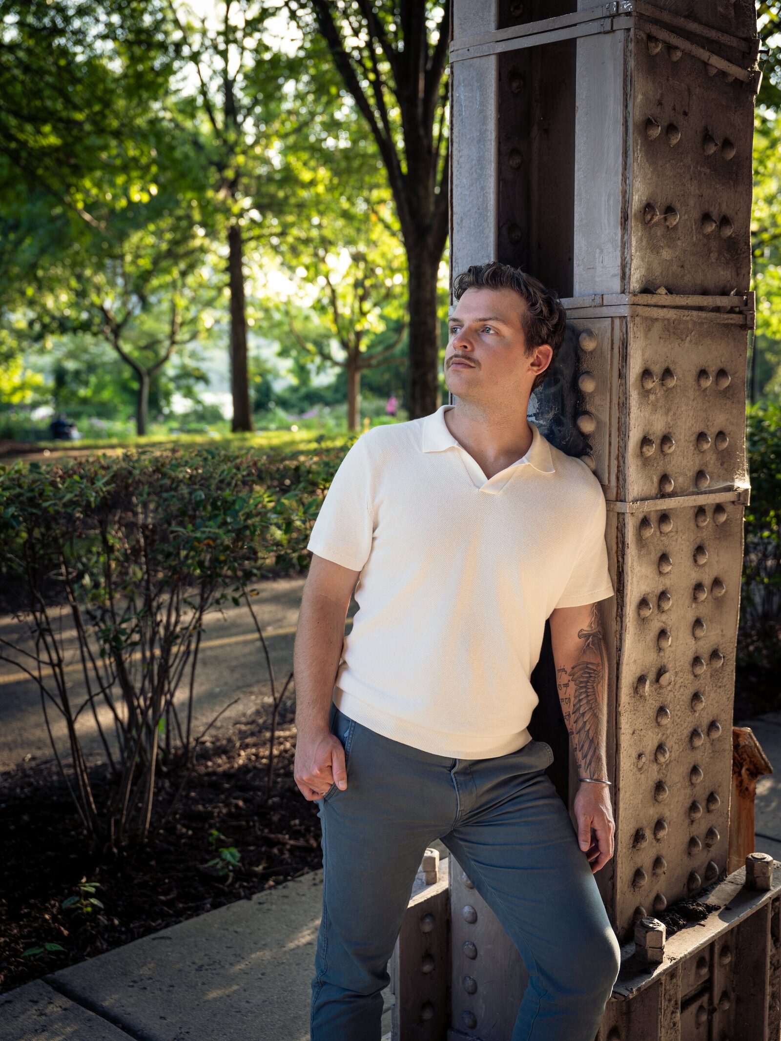 Environmental portrait of a man beside a riveted steel column in Washington, D.C.